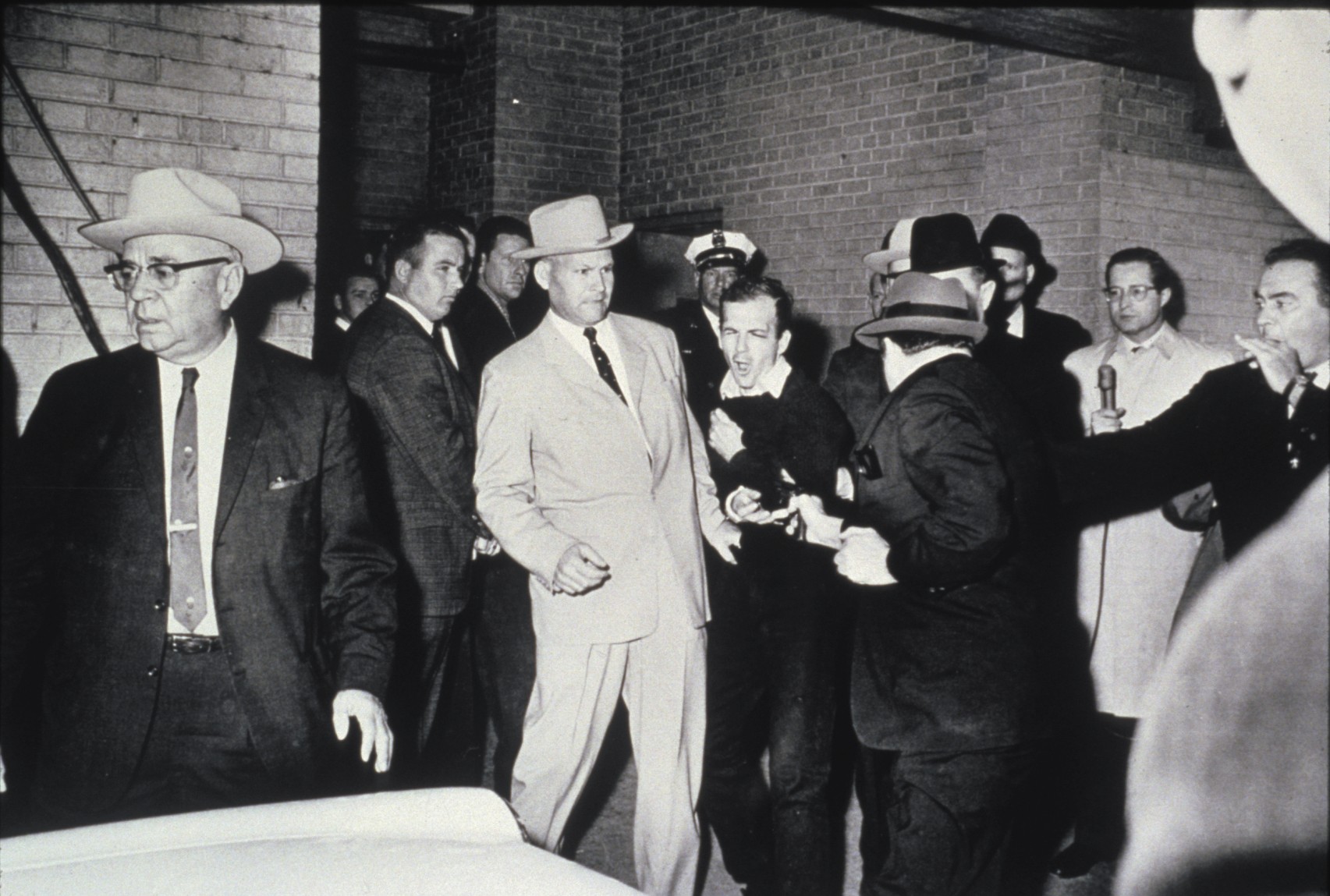 Jack Ruby shoots Lee Harvey Oswald, by Bob Jackson, 1963
