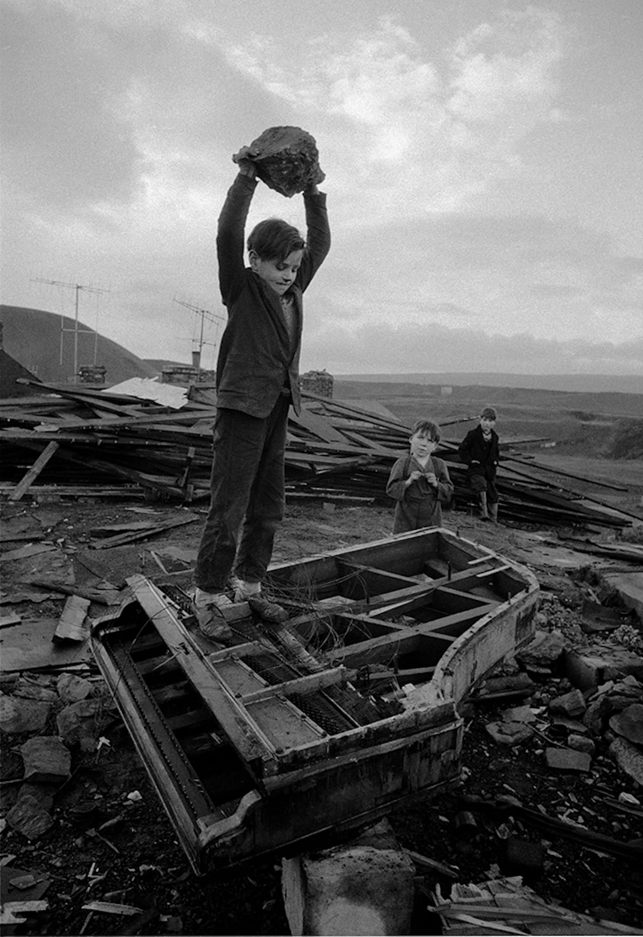 Boy Destroying Piano by Phillip Jones Griffiths